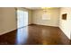 Spacious living room featuring hardwood floors and natural light, leading to an entrance at 5384 Hanging Tree Ln, Las Vegas, NV 89118