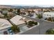 Aerial view captures a home in a vibrant neighborhood with mountain views at 5513 Oakview Falls Ct, Las Vegas, NV 89148