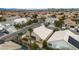 Aerial view of houses with pools and solar panels, situated in a well-maintained neighborhood at 5513 Oakview Falls Ct, Las Vegas, NV 89148