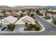 Aerial view of a well-maintained home with a three-car garage and landscaping at 5513 Oakview Falls Ct, Las Vegas, NV 89148