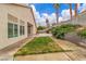 The backyard features a concrete patio, block wall, and partial landscaping at 5513 Oakview Falls Ct, Las Vegas, NV 89148