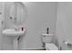 Traditional half bathroom features a pedestal sink and toilet at 5513 Oakview Falls Ct, Las Vegas, NV 89148