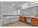 Bright bathroom featuring a built-in tub, double vanity, and tile flooring at 5513 Oakview Falls Ct, Las Vegas, NV 89148