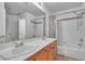 Bathroom featuring a double vanity and a shower/bathtub combo at 5513 Oakview Falls Ct, Las Vegas, NV 89148