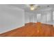 Bedroom with hardwood floors, a ceiling fan, and multiple closets and doors at 5513 Oakview Falls Ct, Las Vegas, NV 89148