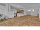 Spacious living room features an open floor plan with tile flooring and stylish lighting fixtures at 5513 Oakview Falls Ct, Las Vegas, NV 89148