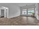 Bright and open living area with neutral tile flooring and large windows, perfect for a comfortable and stylish home at 5513 Oakview Falls Ct, Las Vegas, NV 89148