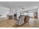 Spacious living room includes tile flooring, a fireplace, and ample natural light at 5513 Oakview Falls Ct, Las Vegas, NV 89148