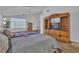 Main bedroom with vaulted ceilings, wood floors, a ceiling fan, and a television at 5513 Oakview Falls Ct, Las Vegas, NV 89148