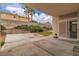Back patio with concrete pavers, landscaping, and block wall at 5513 Oakview Falls Ct, Las Vegas, NV 89148