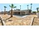 Large backyard featuring a patio and palm trees at 5804 Maynard Ave, Las Vegas, NV 89108