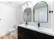 Modern bathroom with a double sink vanity, sleek fixtures, and contemporary lighting at 5804 Maynard Ave, Las Vegas, NV 89108