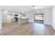 Spacious kitchen and dining area featuring a breakfast bar, stainless appliances, and sliding glass doors at 5804 Maynard Ave, Las Vegas, NV 89108