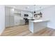 Bright kitchen with modern cabinets, stainless steel appliances, and a breakfast bar at 5804 Maynard Ave, Las Vegas, NV 89108