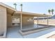 An inviting covered patio with a smooth floor and planting boxes, ideal for outdoor relaxation at 5804 Maynard Ave, Las Vegas, NV 89108
