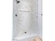 Beautiful walk-in shower with marble-look tile and a built-in niche at 5804 Maynard Ave, Las Vegas, NV 89108