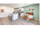 Bright kitchen featuring stainless steel appliances, an island with seating, and an adjacent dining area at 6157 Aster Garden St # 153, North Las Vegas, NV 89081
