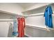 Well-organized walk-in closet with ample shelving and hanging space offers efficient storage solutions for clothing and accessories at 6157 Aster Garden St # 153, North Las Vegas, NV 89081