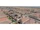 Extensive aerial view displaying a vast community with homes, swimming pools, and streets at 6545 Vanhoven Crest St, Las Vegas, NV 89166