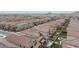 High-angle view of a densely populated residential area featuring swimming pools and consistent home design at 6545 Vanhoven Crest St, Las Vegas, NV 89166