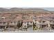 Expansive aerial view of a residential community with modern homes and mountain views at 6545 Vanhoven Crest St, Las Vegas, NV 89166