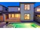 Beautiful backyard featuring a pool, manicured greenery, and a covered patio for outdoor enjoyment at 6545 Vanhoven Crest St, Las Vegas, NV 89166