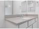 Bright bathroom vanity with a gray countertop and modern fixtures at 6545 Vanhoven Crest St, Las Vegas, NV 89166