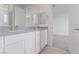 Bathroom featuring double vanity, gray countertop, chrome hardware and neutral paint at 6545 Vanhoven Crest St, Las Vegas, NV 89166
