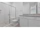 Bathroom with a glass-enclosed shower, grey countertop, and white cabinets at 6545 Vanhoven Crest St, Las Vegas, NV 89166