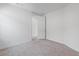 A clean and modern bedroom with neutral walls and carpet at 6545 Vanhoven Crest St, Las Vegas, NV 89166