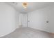 Bright bedroom featuring carpeted floors, modern lighting, and an ensuite bathroom at 6545 Vanhoven Crest St, Las Vegas, NV 89166