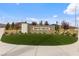 Inviting Skye Hills community entrance sign with stone facade and well-manicured landscaping at 6545 Vanhoven Crest St, Las Vegas, NV 89166