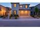 Inviting two-story home with a brick driveway, desert landscaping, and a neutral color palette at 6545 Vanhoven Crest St, Las Vegas, NV 89166