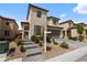 Attractive two-story home with a paved driveway and desert landscaping at 6545 Vanhoven Crest St, Las Vegas, NV 89166