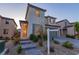Inviting two-story home featuring landscaped front yard and paver walkway leading to entrance at 6545 Vanhoven Crest St, Las Vegas, NV 89166
