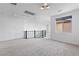 Upstairs hallway featuring plush carpeting, railing and lots of natural light at 6545 Vanhoven Crest St, Las Vegas, NV 89166