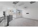 Open and bright hallway with plush carpeting, a railing and lots of natural light at 6545 Vanhoven Crest St, Las Vegas, NV 89166