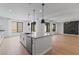 Spacious kitchen with an island, stainless steel appliances, and an open floor plan at 6545 Vanhoven Crest St, Las Vegas, NV 89166