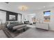 Modern primary bedroom boasts a sitting area, stylish decor, and ample natural light at 6545 Vanhoven Crest St, Las Vegas, NV 89166