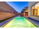 A sparkling pool surrounded by lush greenery, offering a serene backyard retreat with ample privacy at 6545 Vanhoven Crest St, Las Vegas, NV 89166
