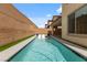 Refreshing swimming pool with serene water, ideal for relaxation in a private backyard oasis at 6545 Vanhoven Crest St, Las Vegas, NV 89166
