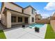 Inviting backyard pool with sleek modern lounge chairs and covered patio area for outdoor relaxation and entertaining at 6545 Vanhoven Crest St, Las Vegas, NV 89166