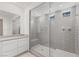 Modern shower boasts gray subway tile, glass enclosure, and recessed lighting for a spa-like feel at 6545 Vanhoven Crest St, Las Vegas, NV 89166