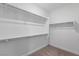 Bright walk-in closet with multiple rods and shelves for maximum storage at 6545 Vanhoven Crest St, Las Vegas, NV 89166