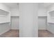 Spacious walk-in closet with carpet and built-in shelving for optimal organization at 6545 Vanhoven Crest St, Las Vegas, NV 89166