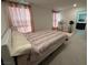 Bright bedroom with pink accents and ample natural light at 6999 Bard Ave, Las Vegas, NV 89113