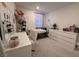 Bright bedroom with neutral decor and a large window for natural light at 6999 Bard Ave, Las Vegas, NV 89113