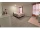 Comfortable bedroom featuring large windows and neutral colors at 6999 Bard Ave, Las Vegas, NV 89113