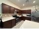 Modern kitchen with stainless steel appliances and white countertops at 6999 Bard Ave, Las Vegas, NV 89113