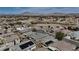 Aerial view of community featuring mountain views and desert landscaping at 703 Flaming Cliffs Ct, Henderson, NV 89014